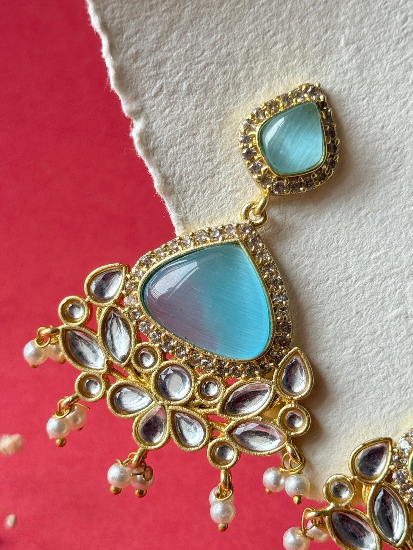 Silk Stone Embedded Party Wear Golden Earrings
